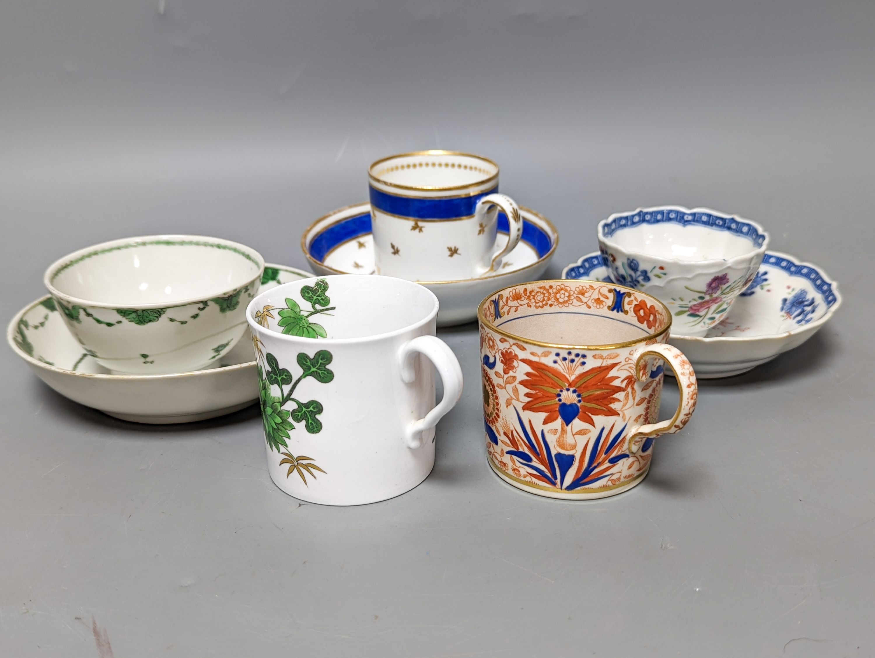 Two 18th century Chinese tea bowls, a 19th century German coffee can and saucer, a Spode coffee can and another